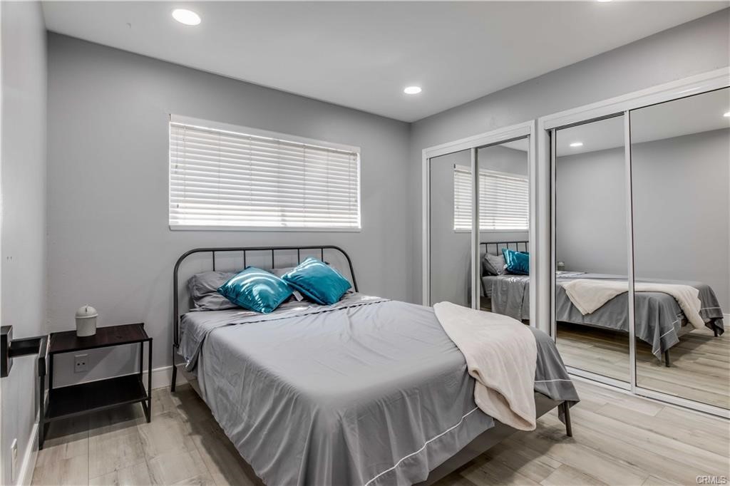 10664 Morning Glory Avenue Fountain Valley, CA 92708 - Photo 20 of 31 a bedroom with a bed and dresser with mirror