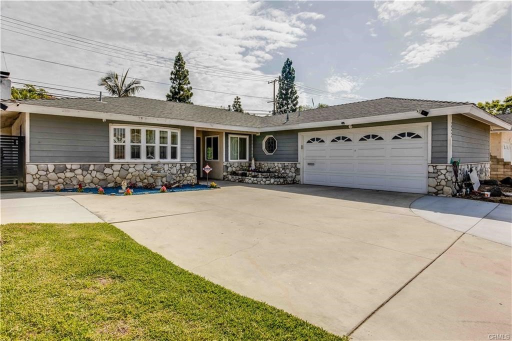 10664 Morning Glory Avenue Fountain Valley, CA 92708 - Photo 2 of 31 a front view of a house with yard