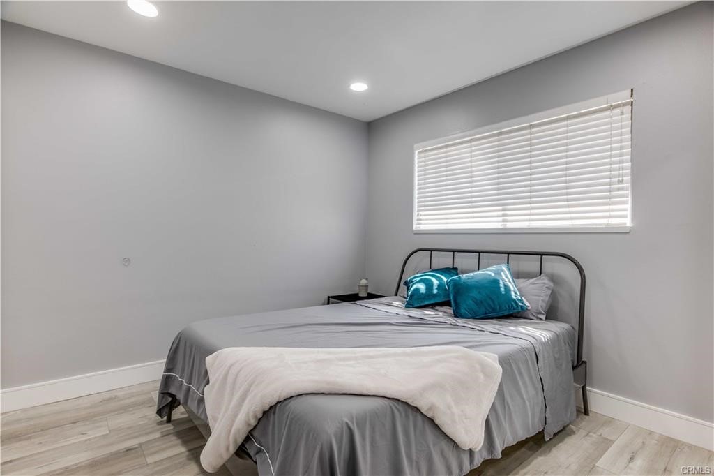 10664 Morning Glory Avenue Fountain Valley, CA 92708 - Photo 21 of 31 a bedroom with a bed and a window