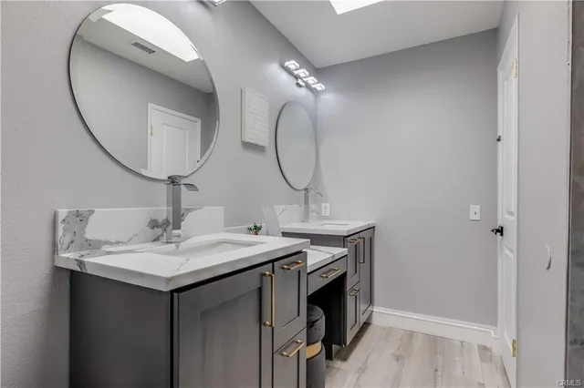 a bathroom with a sink and a mirror