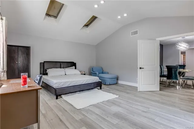 a bedroom with a bed and a table