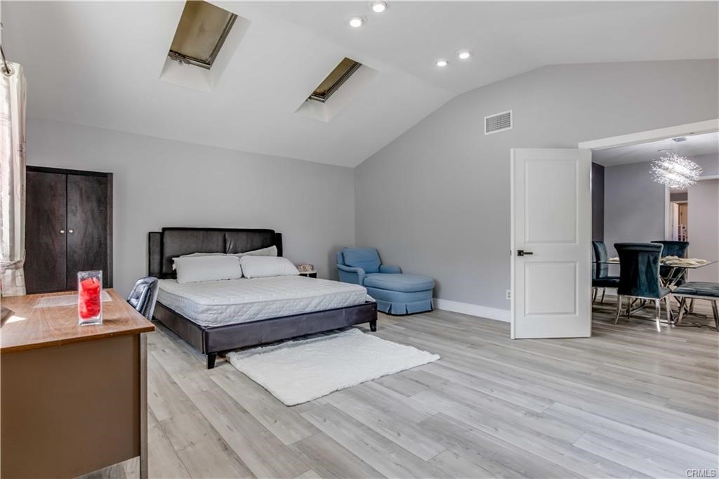 10664 Morning Glory Avenue Fountain Valley, CA 92708 - Photo 25 of 31 a bedroom with a bed and a table