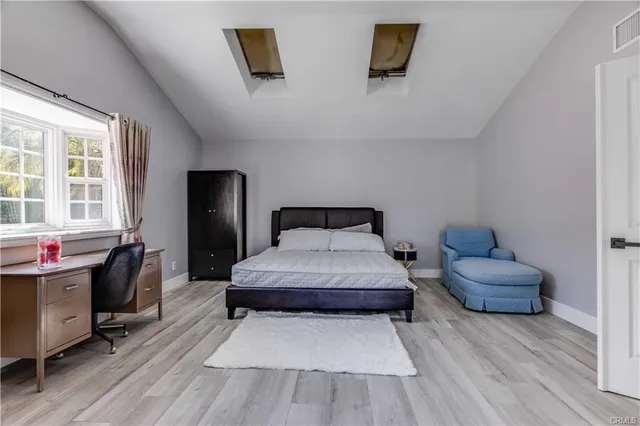 a living room with furniture and a chair