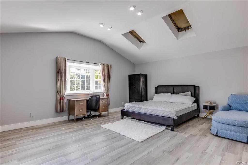 10664 Morning Glory Avenue Fountain Valley, CA 92708 - Photo 27 of 31 a spacious bedroom with a bed and a window