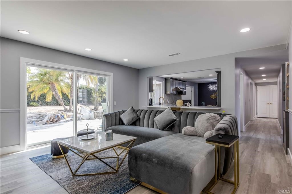 10664 Morning Glory Avenue Fountain Valley, CA 92708 - Photo 4 of 31 a living room with furniture and a large window