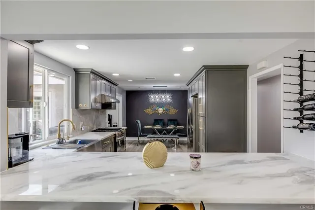 a room with lots of chairs and mirrors