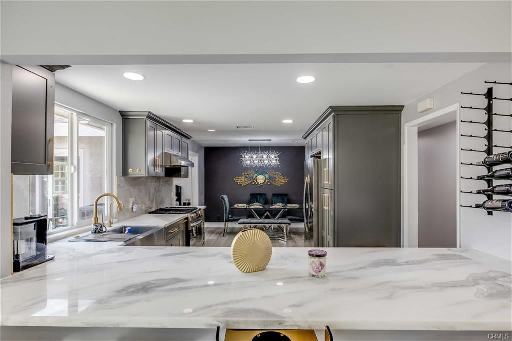 10664 Morning Glory Avenue Fountain Valley, CA 92708 - Photo 8 of 31 a room with lots of chairs and mirrors