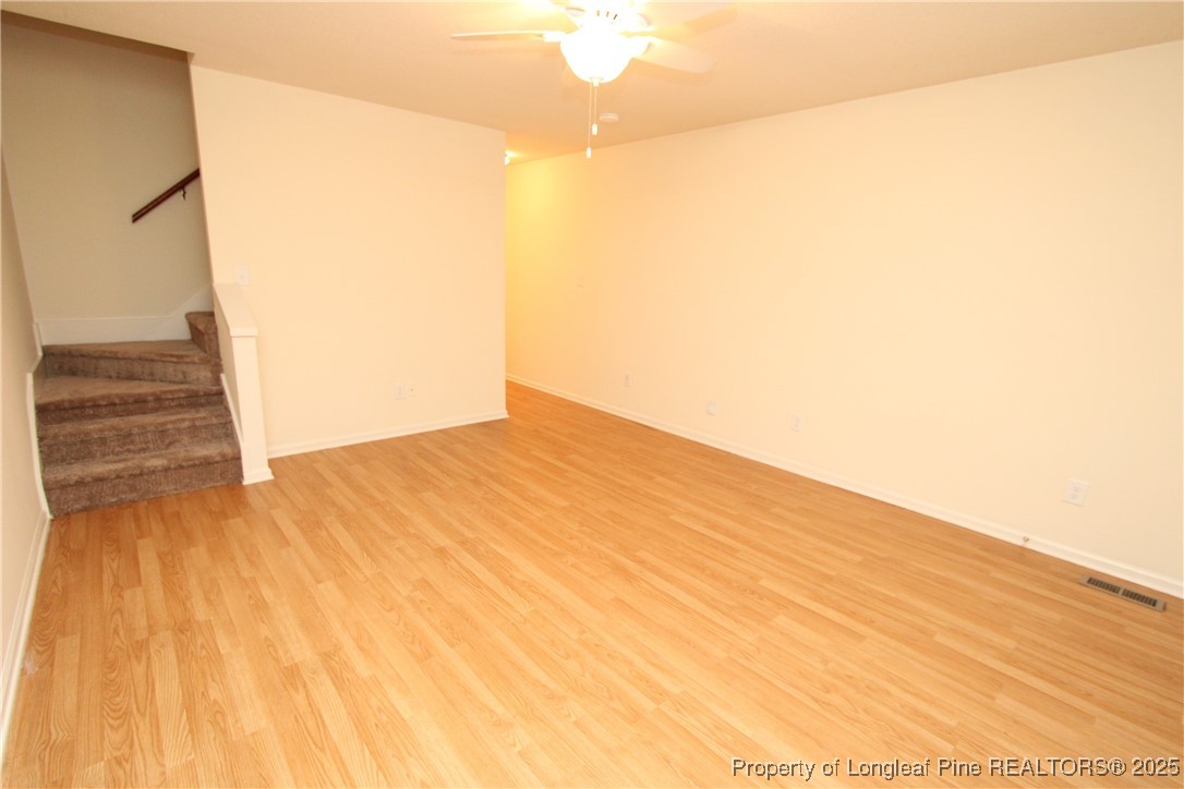 6124 Deerwood Place Raleigh, NC 27607 - Photo 3 of 22 a view of empty room with wooden floor
