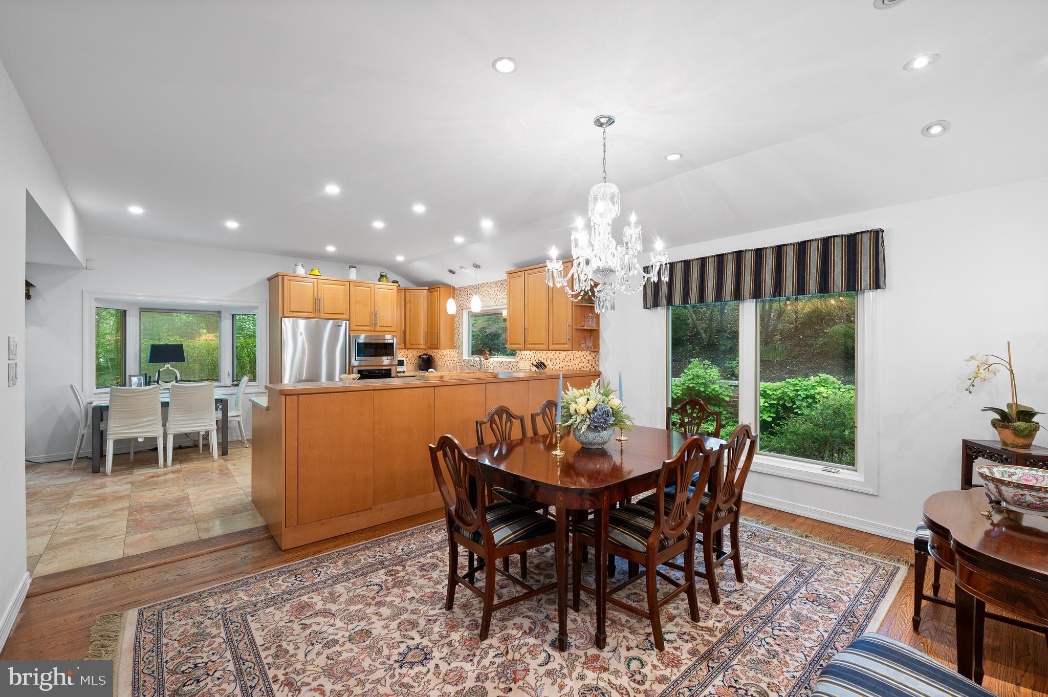 590 Fletcher Road Wayne, PA 19087 - Photo 11 of 44 a dining room with furniture a chandelier and wooden floor
