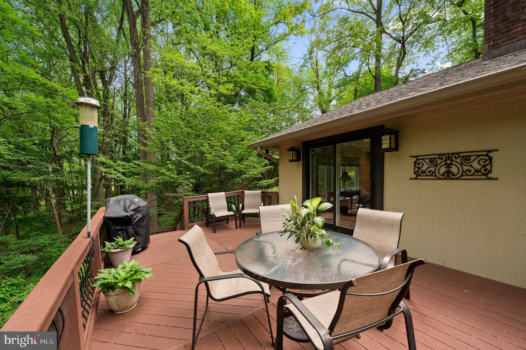 590 Fletcher Road Wayne, PA 19087 - Photo 19 of 44 a backyard of a house with table and chairs