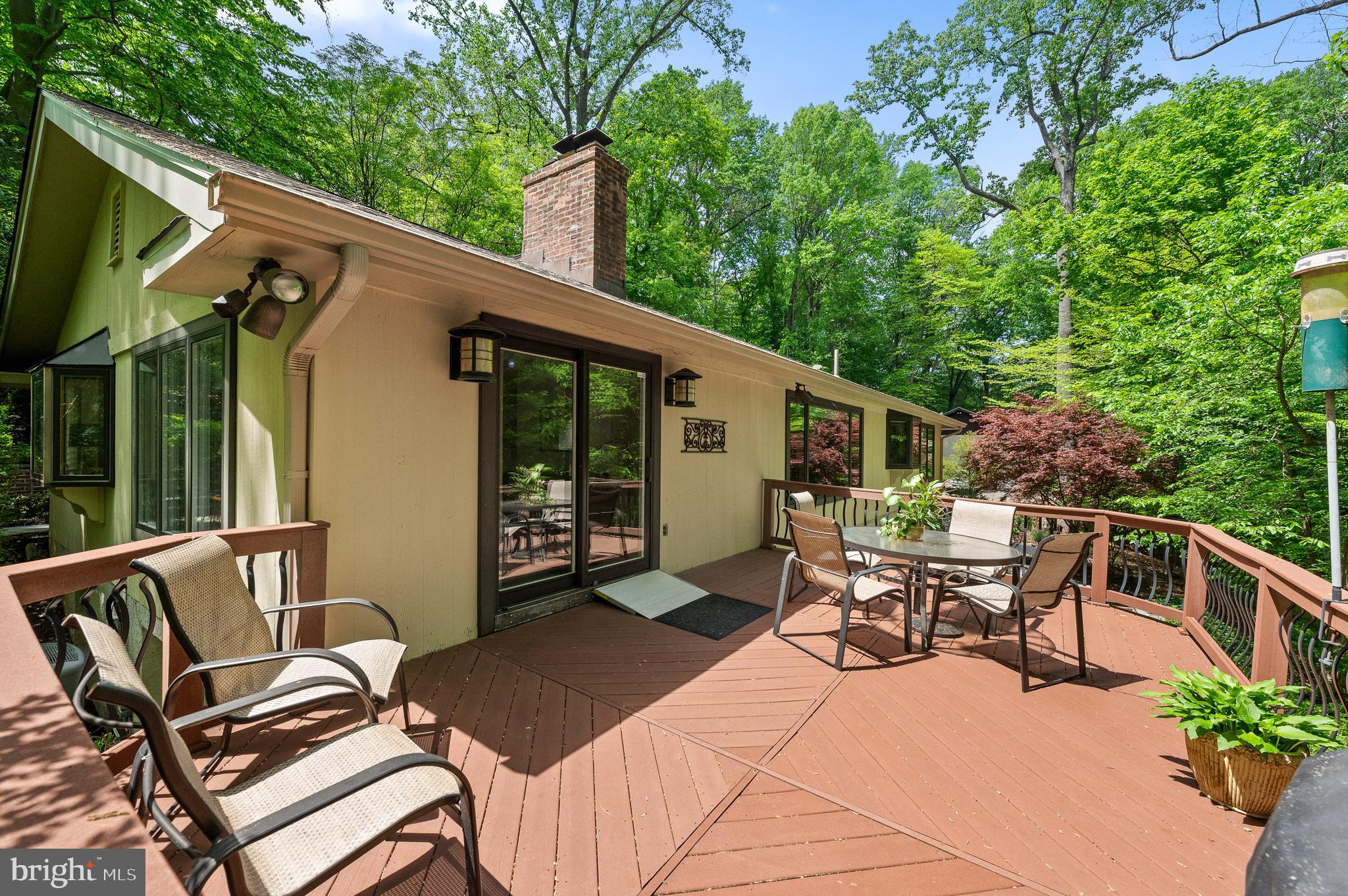 590 Fletcher Road Wayne, PA 19087 - Photo 21 of 44 a view of a patio with a table chairs and backyard