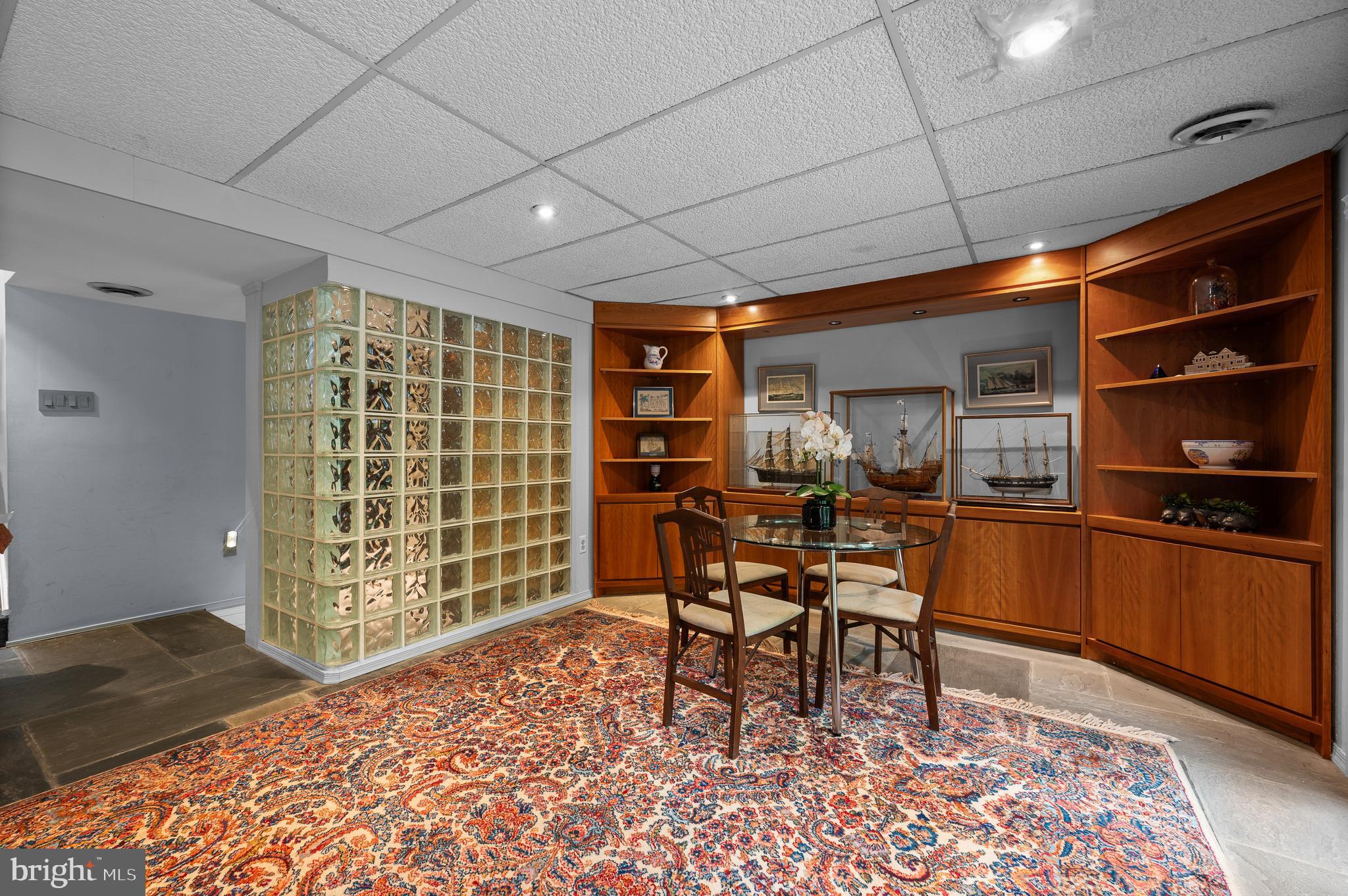 590 Fletcher Road Wayne, PA 19087 - Photo 30 of 44 a dining room with a wooden table and chairs
