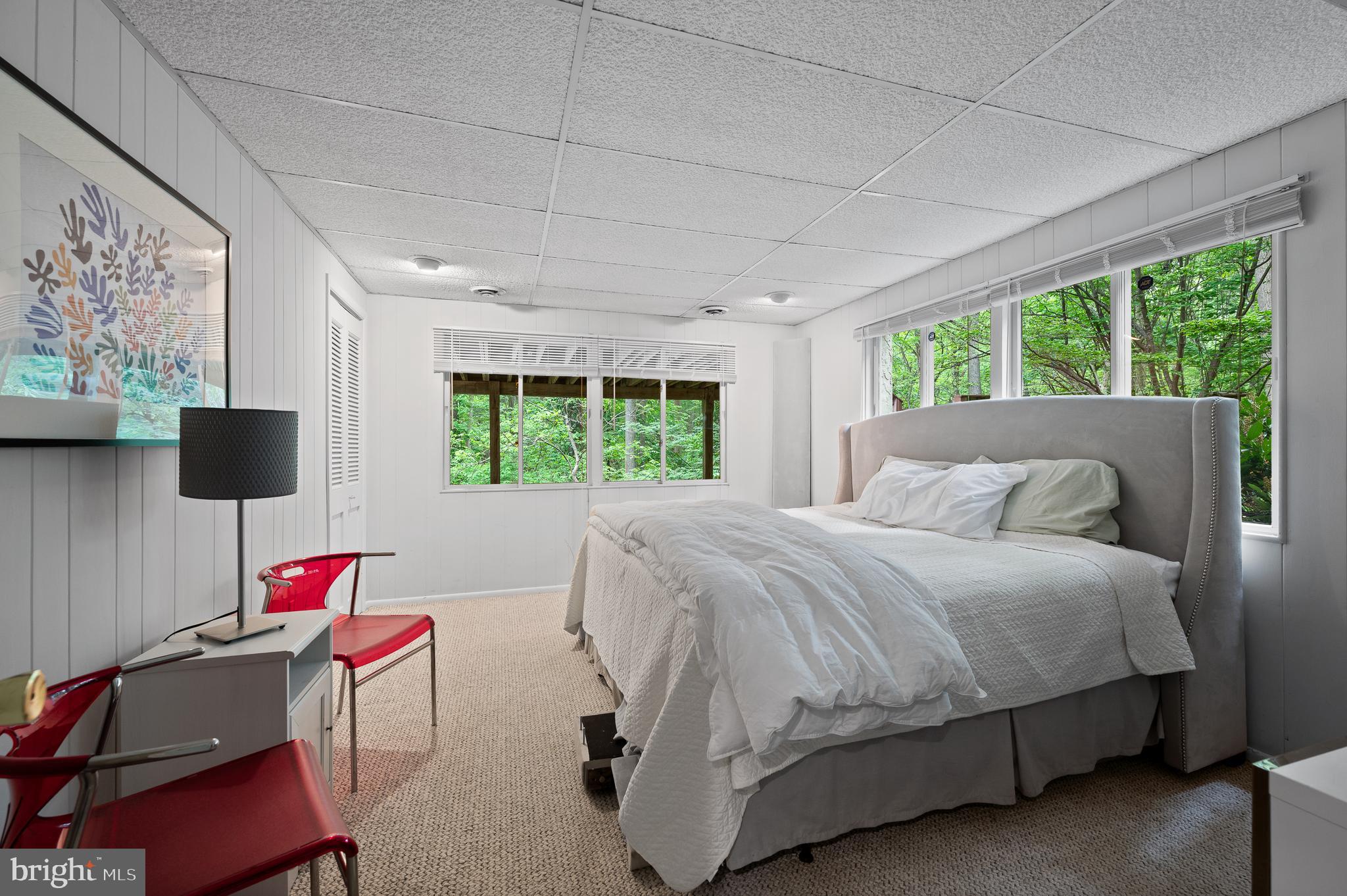 590 Fletcher Road Wayne, PA 19087 - Photo 32 of 44 a bedroom with a bed window and a flat screen tv