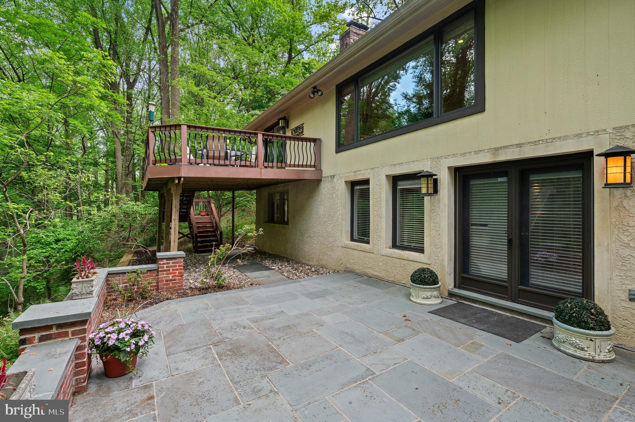 590 Fletcher Road Wayne, PA 19087 - Photo 38 of 44 a view of a chair and table in backyard of the house
