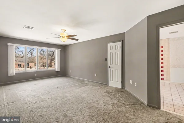 a view of an empty room with a window