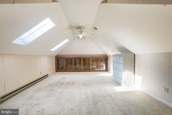 an empty room with a empty space and windows