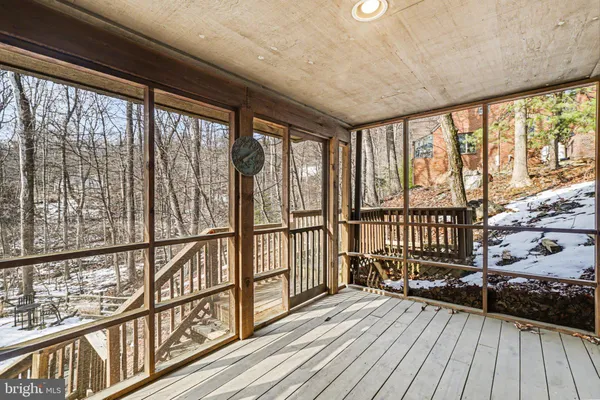 a view of a balcony with wooden floor