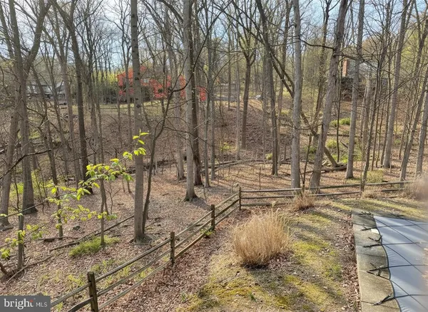 a view of a house with yard and sitting area