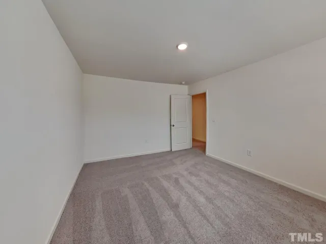 a white bath tub sitting next to a white toilet