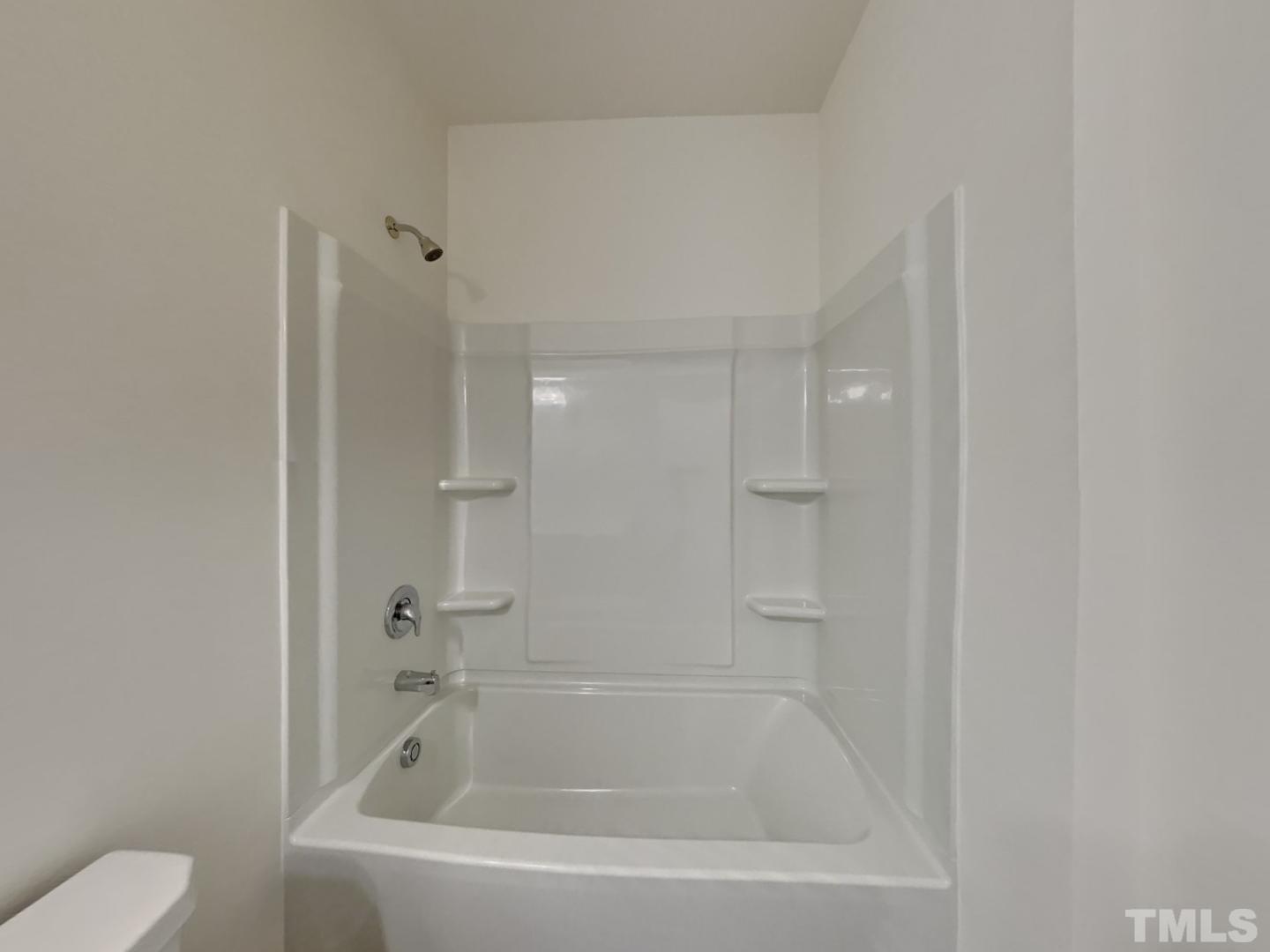 117 Mdw Vista Lane Angier, NC 27501 - Photo 13 of 18 a white bath tub sitting next to a white toilet
