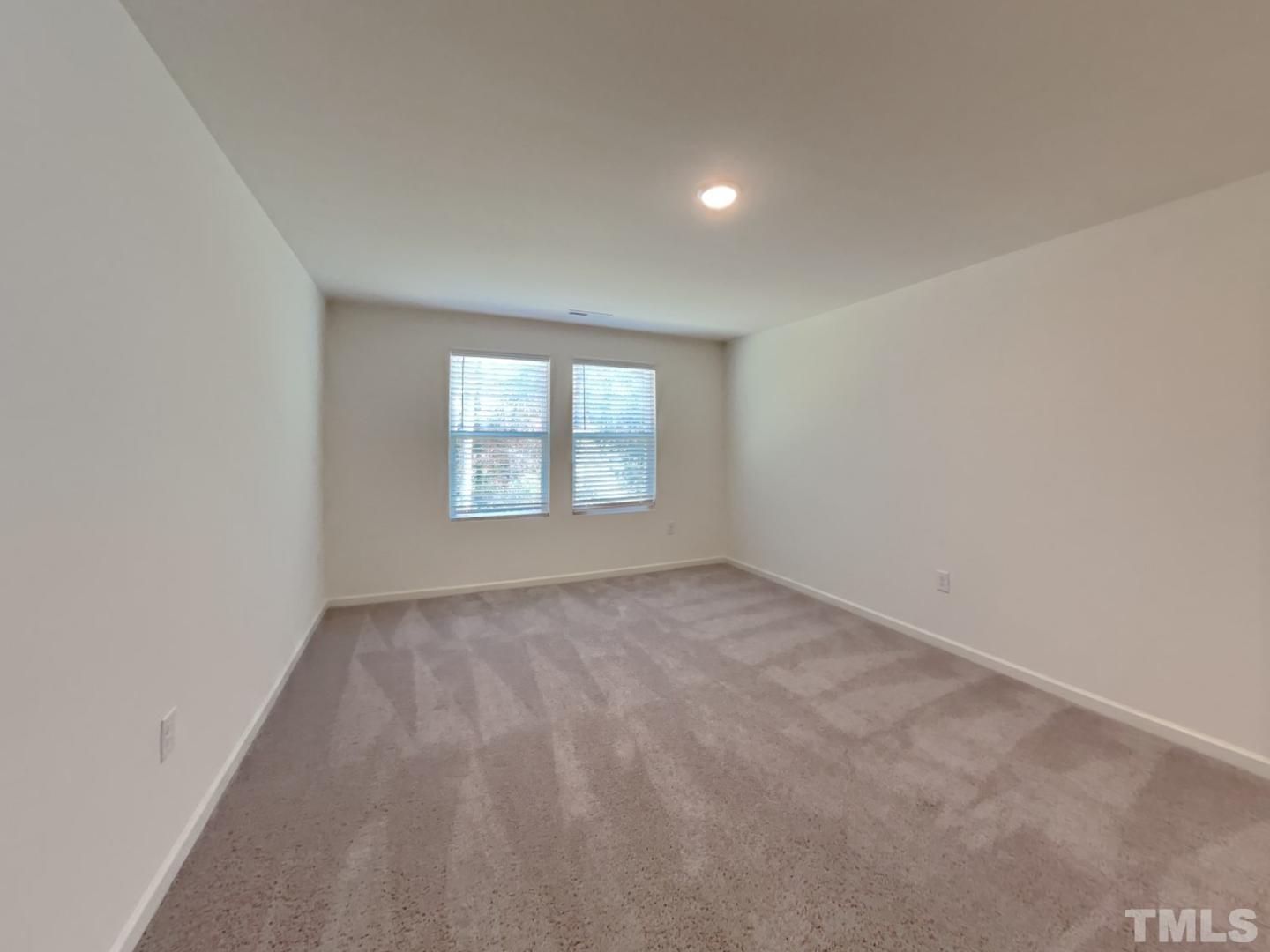 117 Mdw Vista Lane Angier, NC 27501 - Photo 17 of 18 an empty room with a window