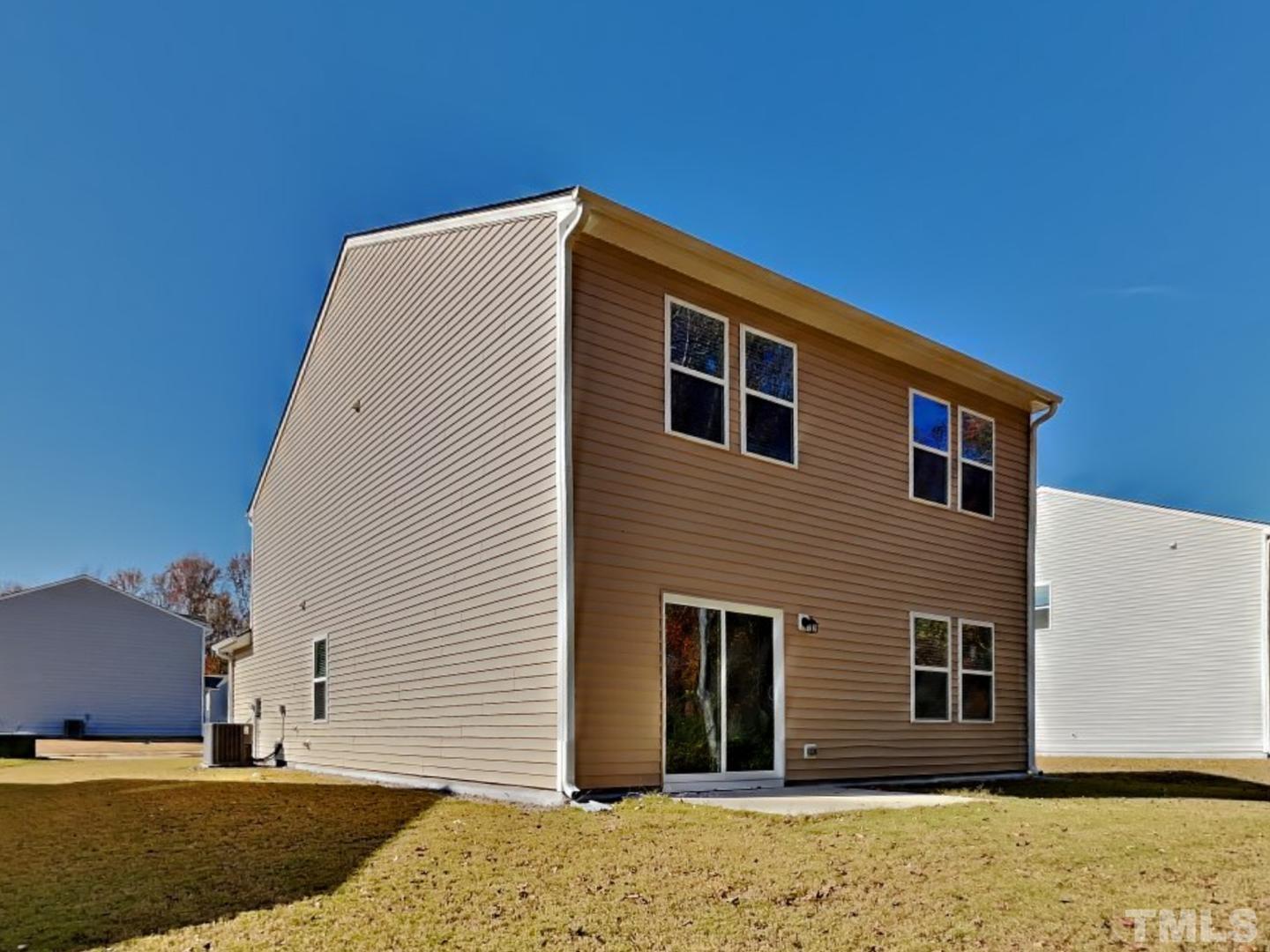 117 Mdw Vista Lane Angier, NC 27501 - Photo 18 of 18 a view of a house with a backyard