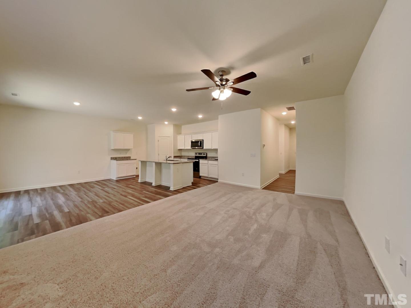 117 Mdw Vista Lane Angier, NC 27501 - Photo 2 of 18 a view of kitchen and empty room with a window