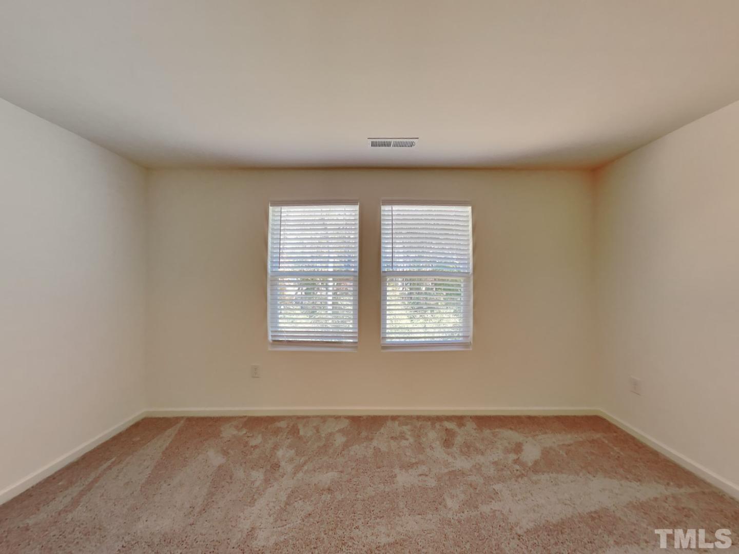 117 Mdw Vista Lane Angier, NC 27501 - Photo 4 of 18 an empty room with a window