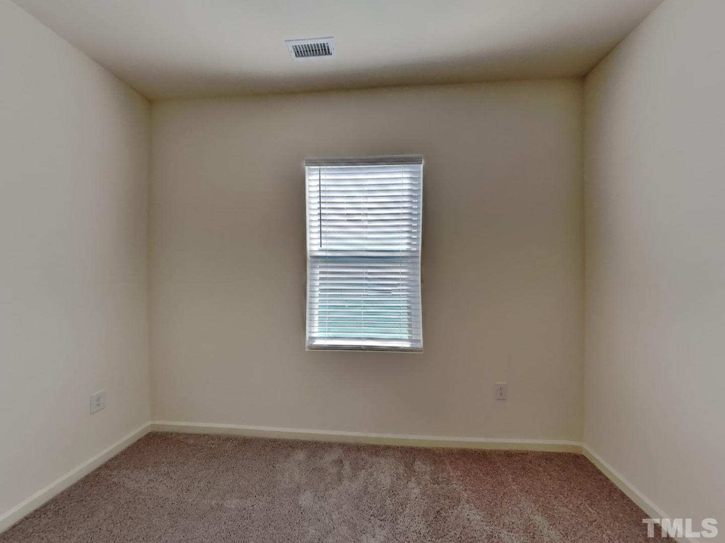 117 Mdw Vista Lane Angier, NC 27501 - Photo 7 of 18 an empty room with a window