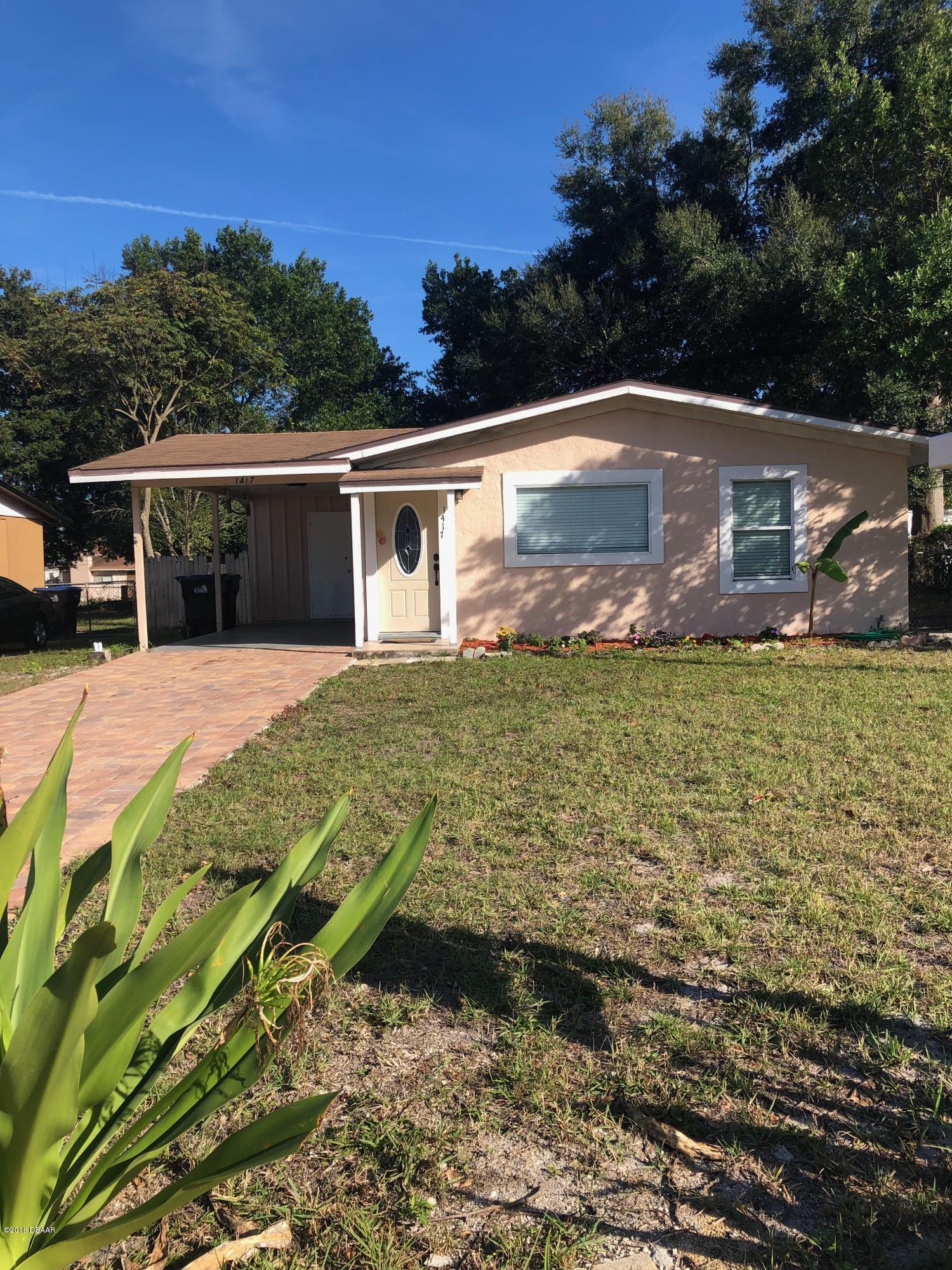 1417 Constantine Street Orlando, FL 32825 - Photo 2 of 14 a view of a house with a yard