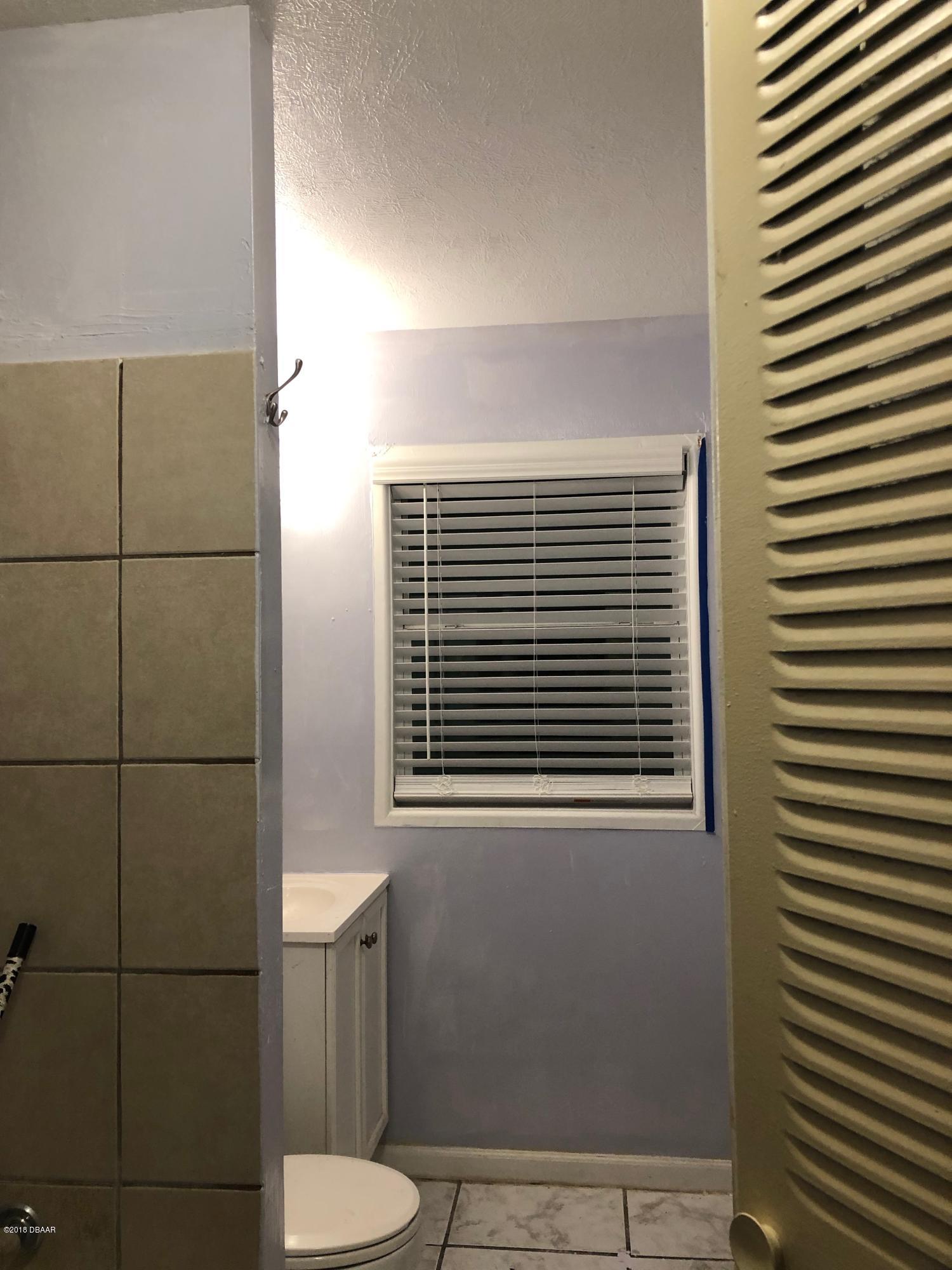 1417 Constantine Street Orlando, FL 32825 - Photo 7 of 14 a bathroom with a sink and a toilet