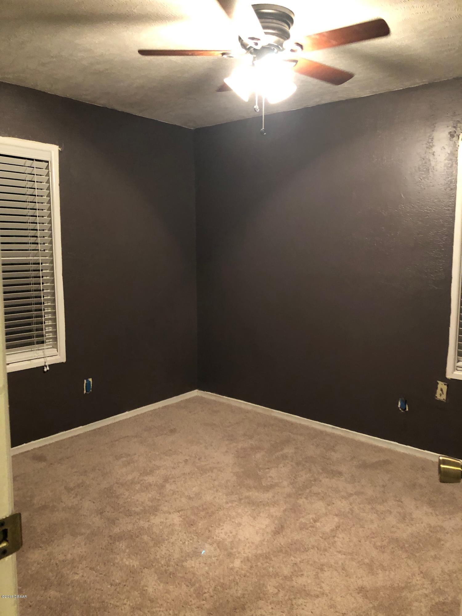 1417 Constantine Street Orlando, FL 32825 - Photo 10 of 14 a view of an empty room with a window