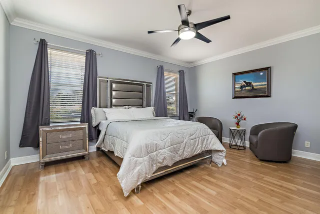 a bedroom with a bed and a chair