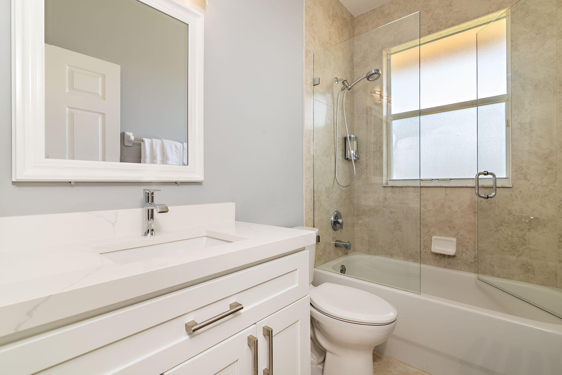 6813 Wilson Road West Palm Beach, FL 33413 - Photo 20 of 26 a bathroom with a sink a toilet and a bathtub