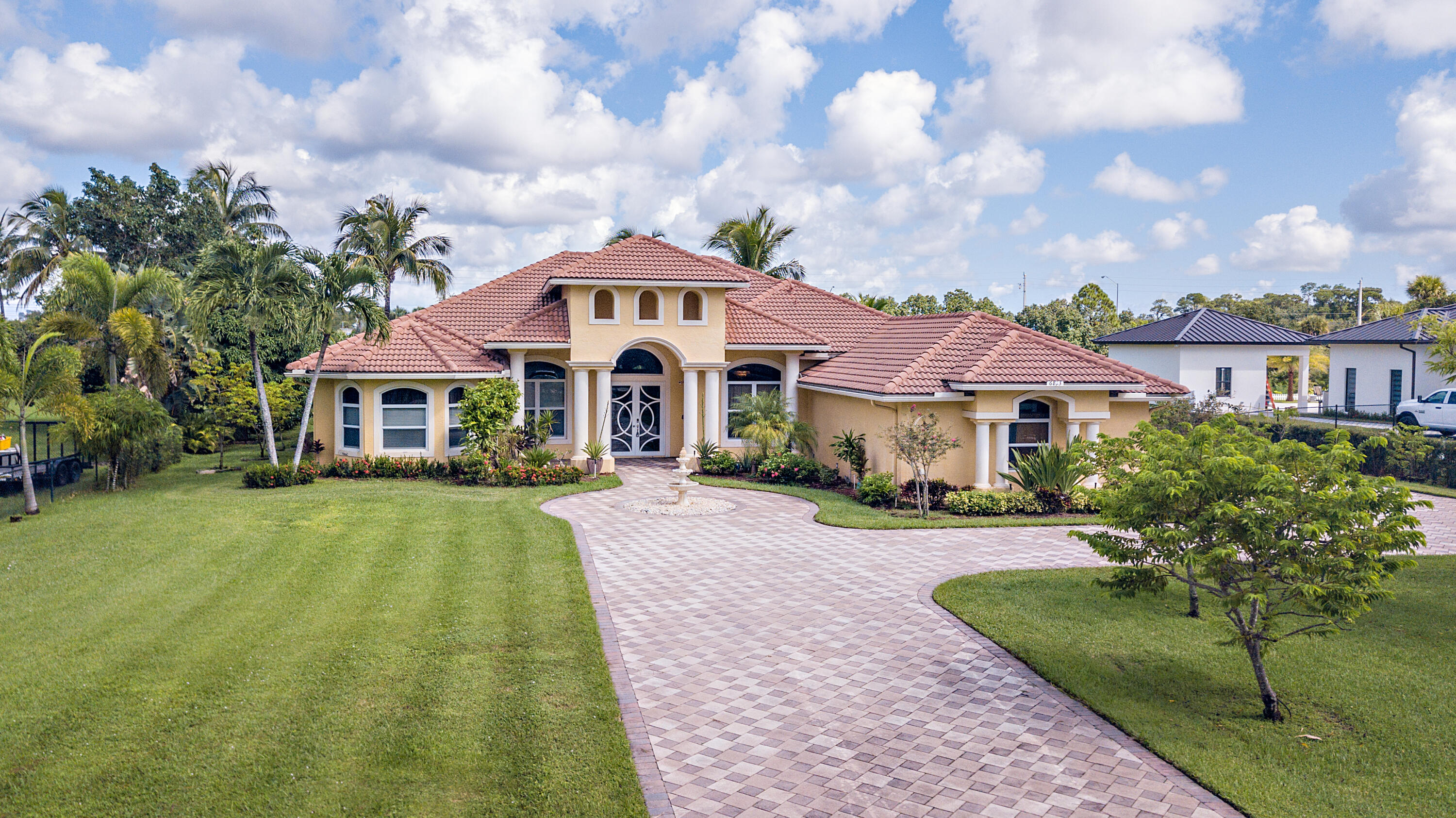 6813 Wilson Road West Palm Beach, FL 33413 - Photo 2 of 26 a front view of a house with yard and green space