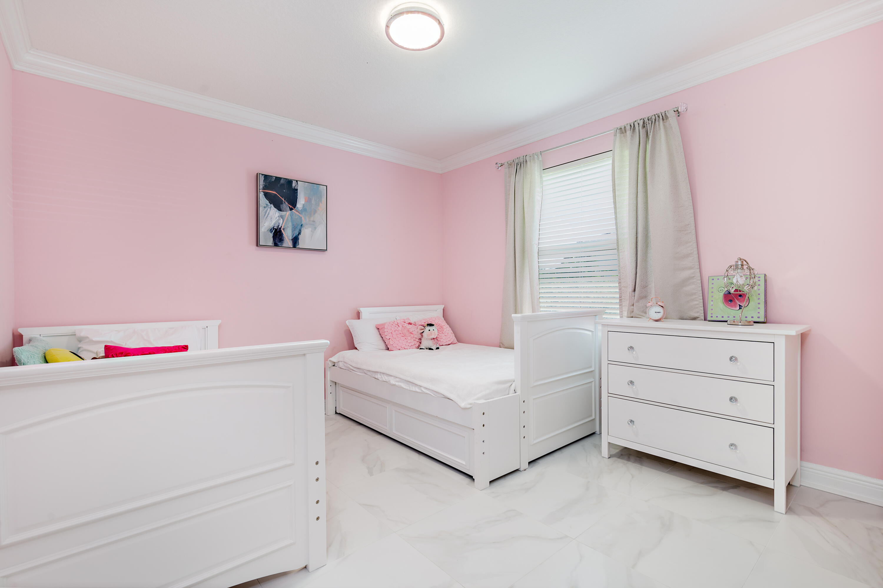 6813 Wilson Road West Palm Beach, FL 33413 - Photo 21 of 26 a room with a bed a dresser and next to a window