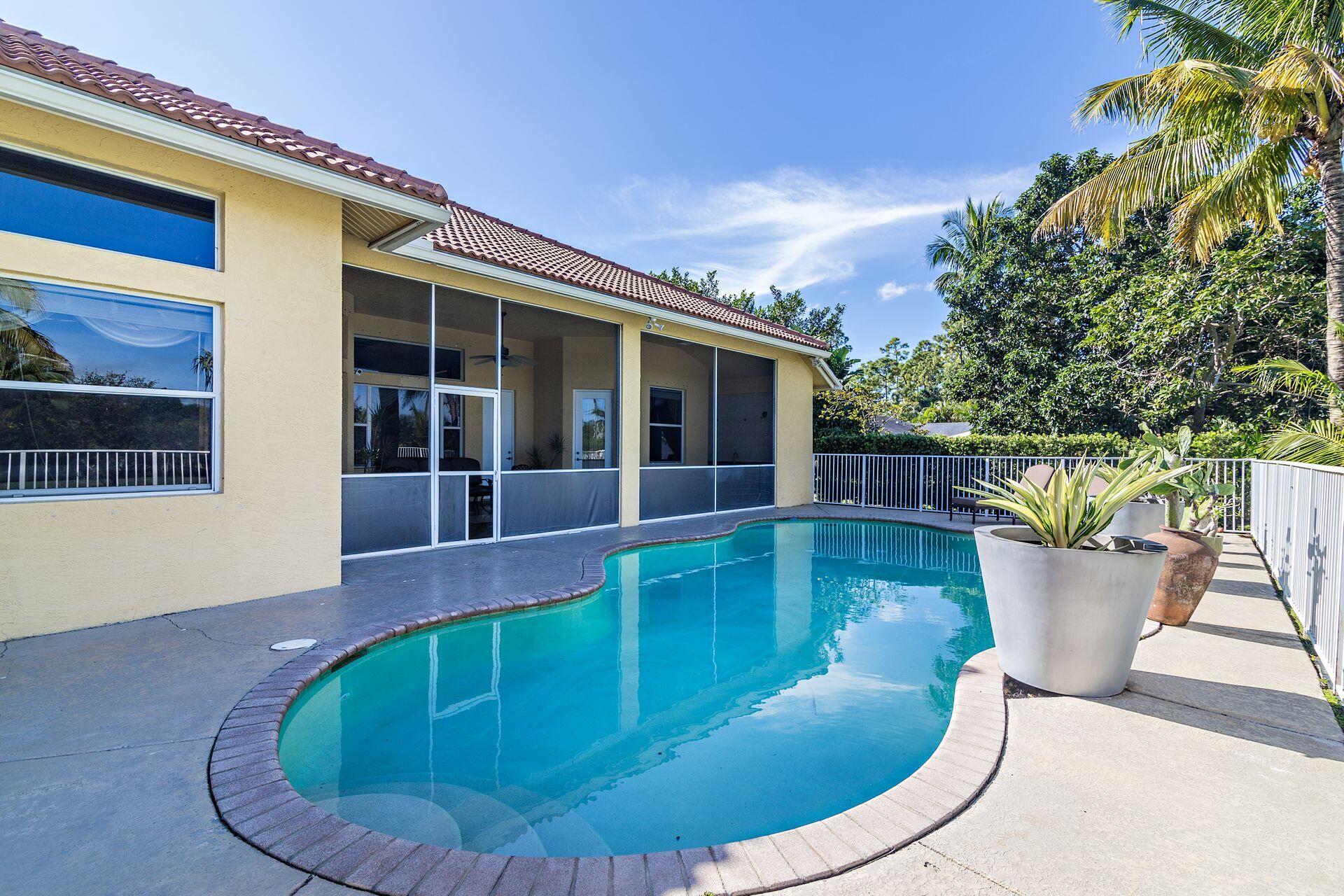 6813 Wilson Road West Palm Beach, FL 33413 - Photo 25 of 26 a view of a swimming pool in back of house