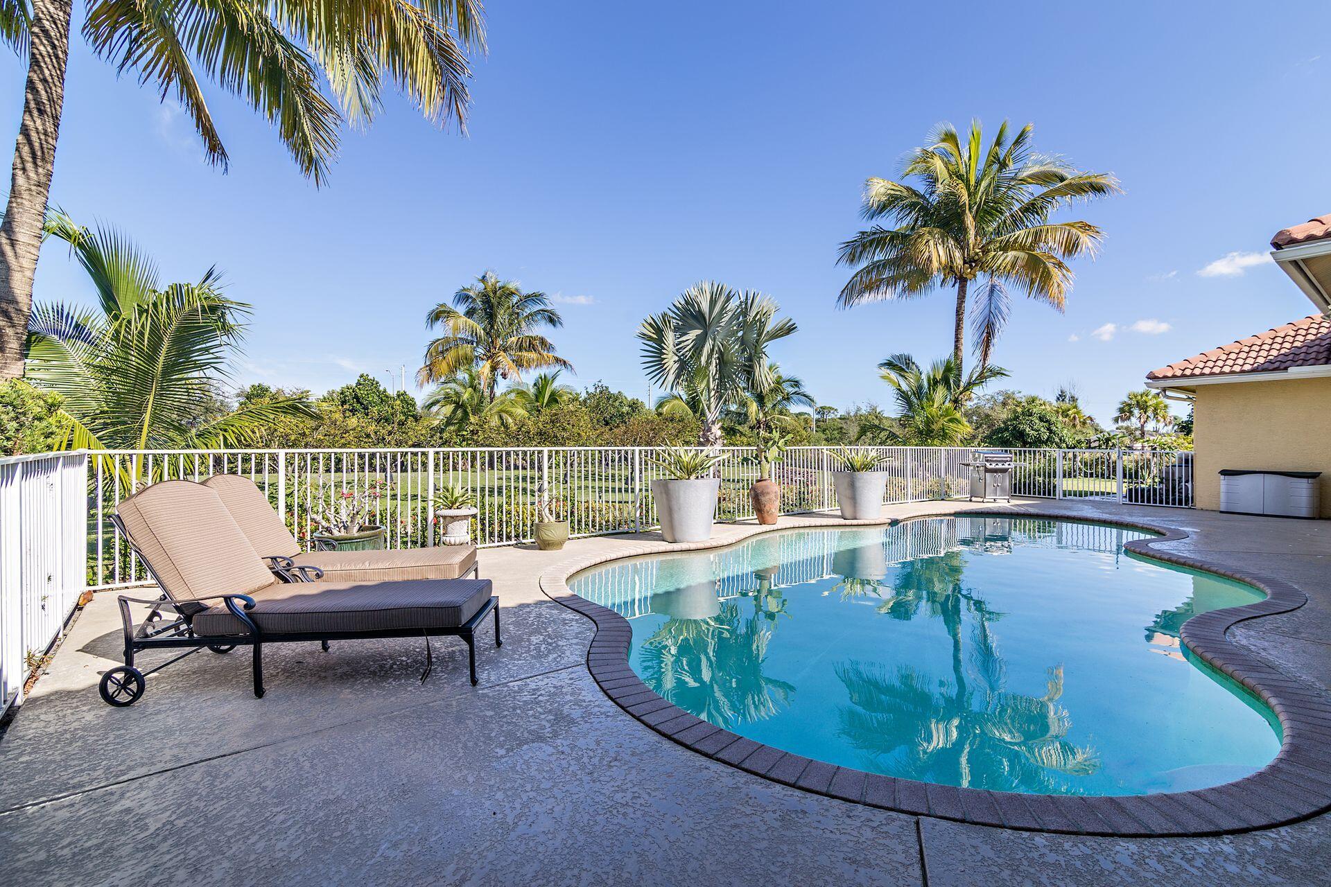 6813 Wilson Road West Palm Beach, FL 33413 - Photo 26 of 26 a view of a swimming pool with a lounge chair