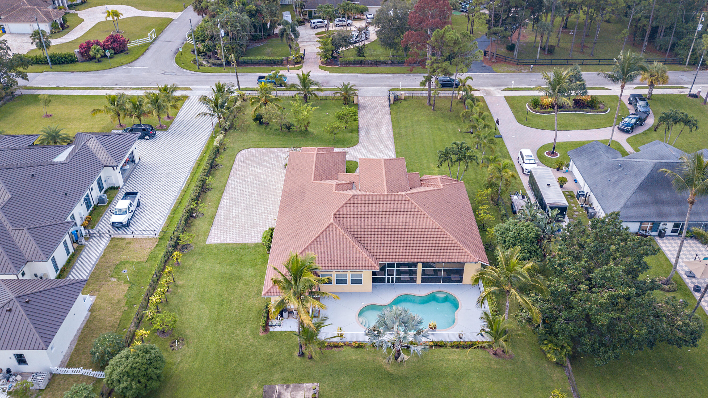 6813 Wilson Road West Palm Beach, FL 33413 - Photo 3 of 26 an aerial view of a house with a swimming pool and outdoor space