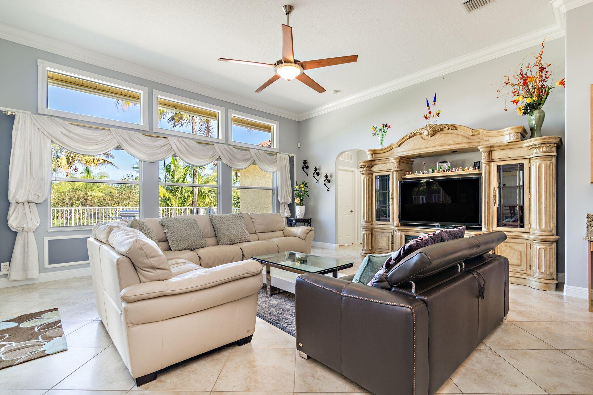 6813 Wilson Road West Palm Beach, FL 33413 - Photo 6 of 26 a living room with furniture and a flat screen tv