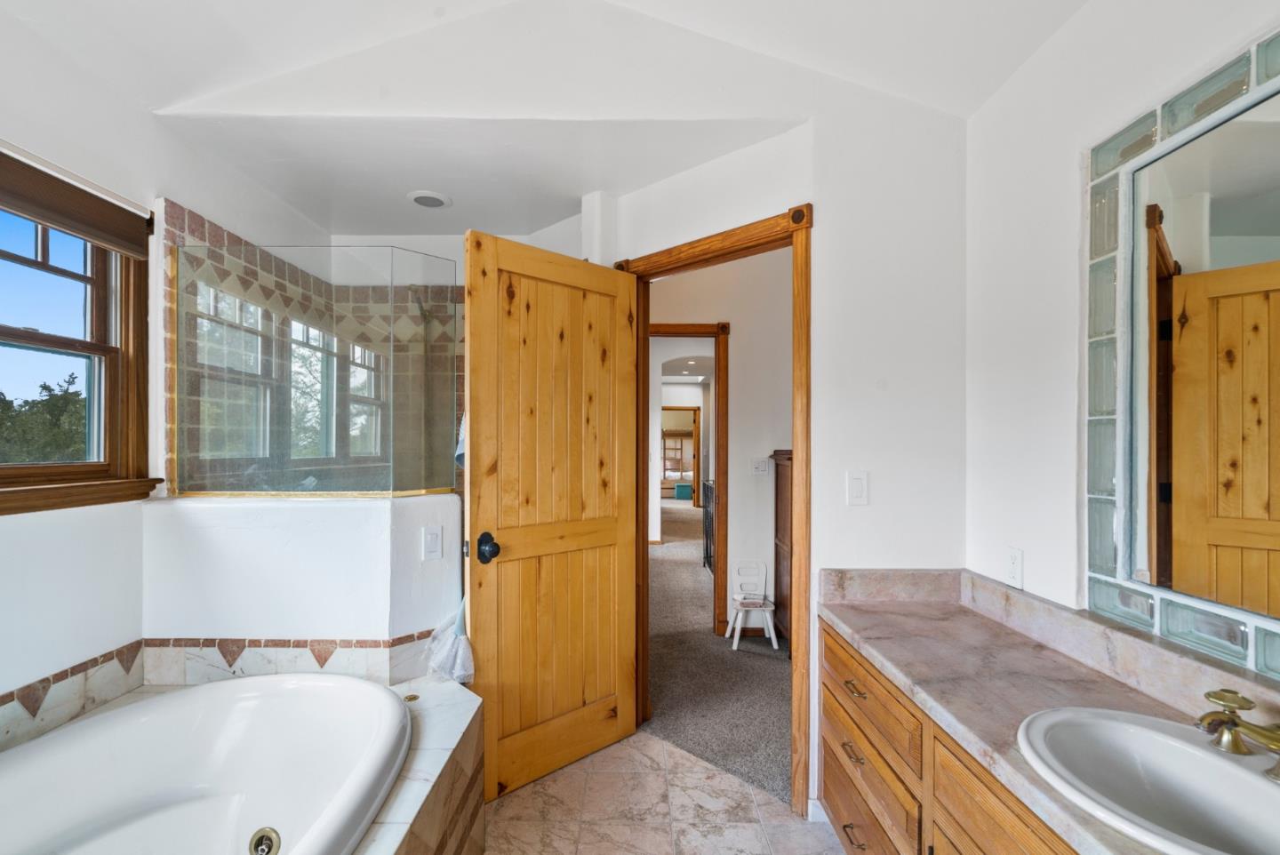 787 Rider Ridge Road Santa Cruz, CA 95065 - Photo 23 of 39 a bathroom with a tub sink and mirror
