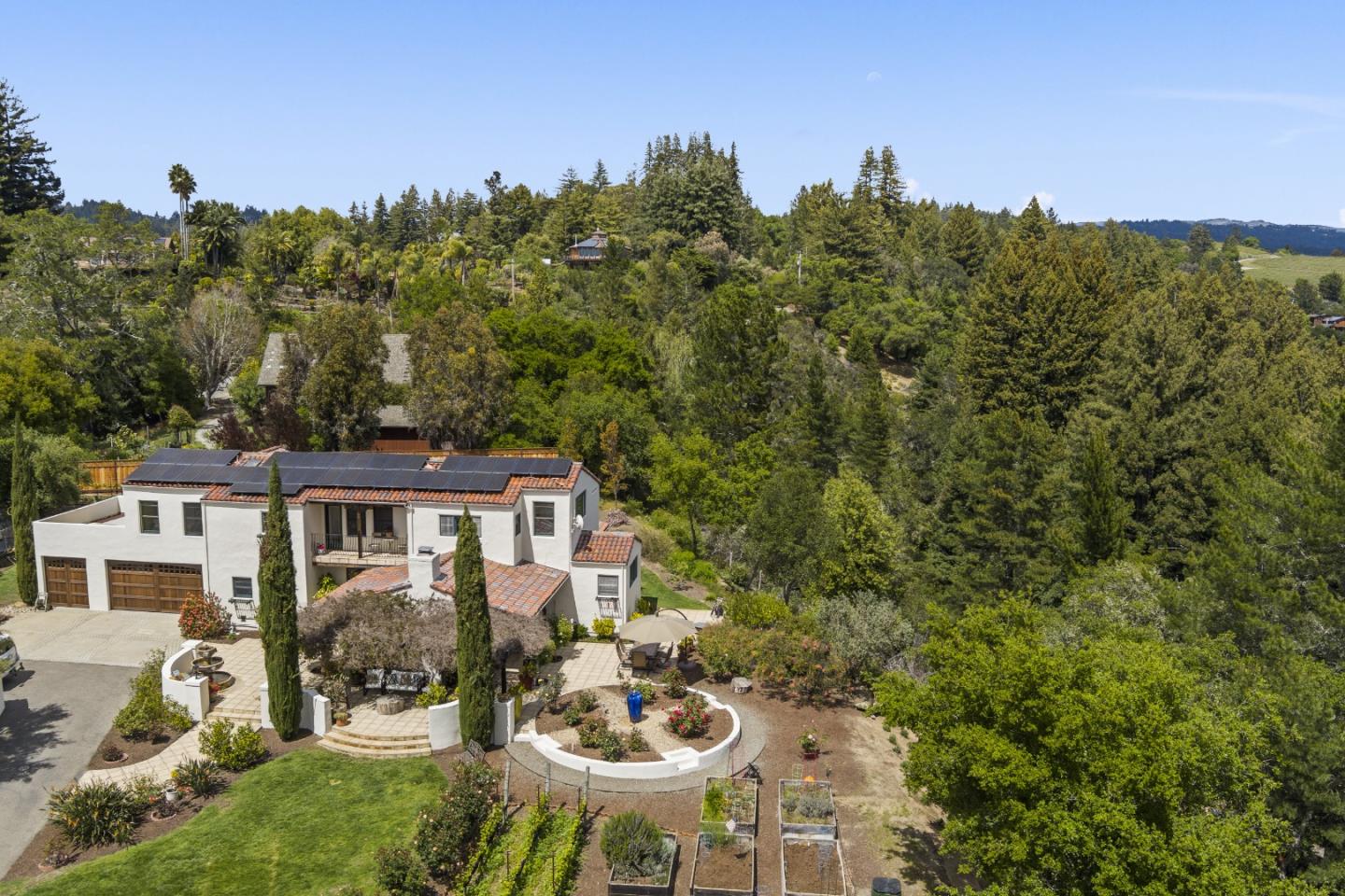 787 Rider Ridge Road Santa Cruz, CA 95065 - Photo 32 of 39 a view of a patio with couches table and chairs and potted plants