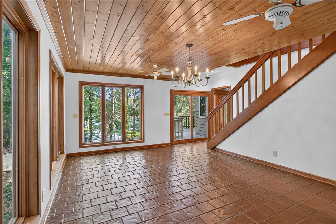 12 Lookout Lane Salem, SC 29676 - Photo 30 of 47 Downstairs: Lots of windows light up this wood plank ceiling and brick-patterned flooring.