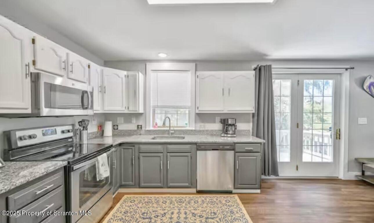 4562 Highway 374 Nicholson, PA 18446 - Photo 11 of 38 a kitchen with a sink stove and cabinets