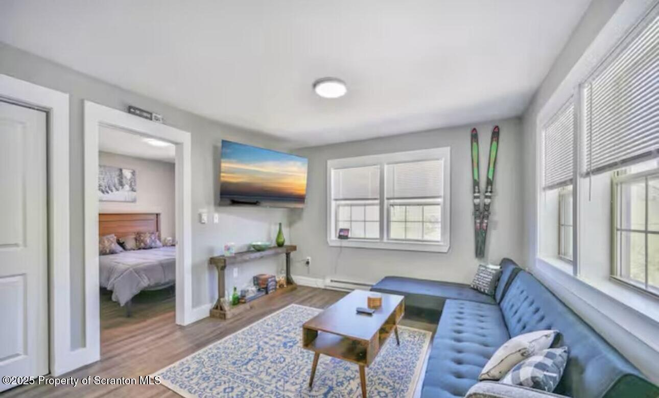 4562 Highway 374 Nicholson, PA 18446 - Photo 14 of 38 a living room with furniture and a window