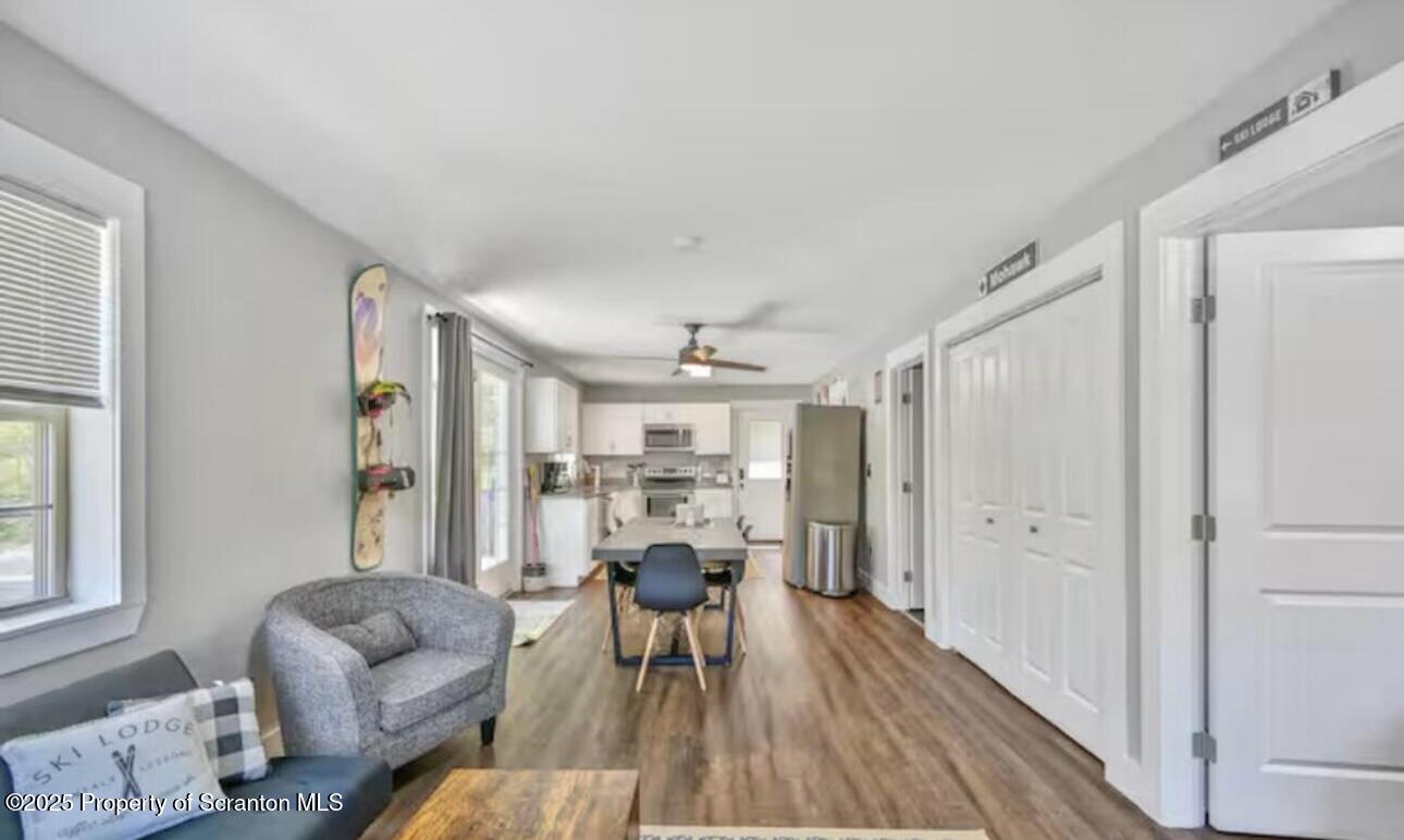 4562 Highway 374 Nicholson, PA 18446 - Photo 15 of 38 a living room with furniture and a wooden floor