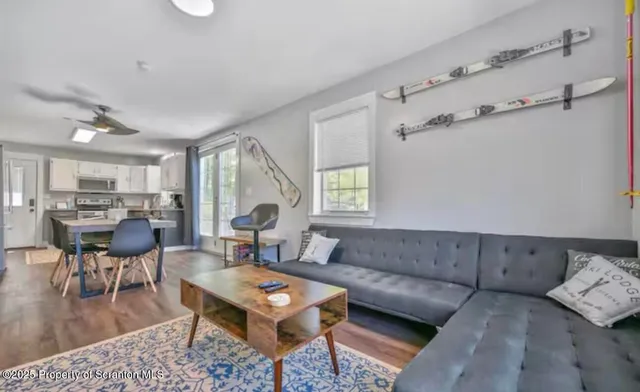 a kitchen with stainless steel appliances kitchen island granite countertop a refrigerator and a stove top oven