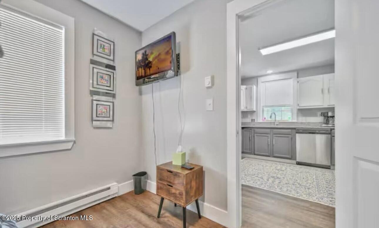 4562 Highway 374 Nicholson, PA 18446 - Photo 20 of 38 a kitchen with stainless steel appliances kitchen island granite countertop a refrigerator and a stove top oven