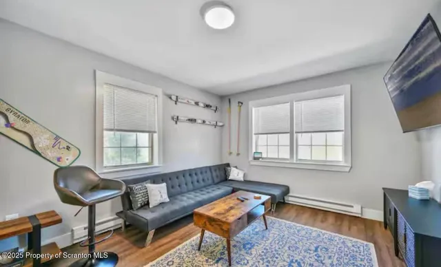 a living room with furniture and a window