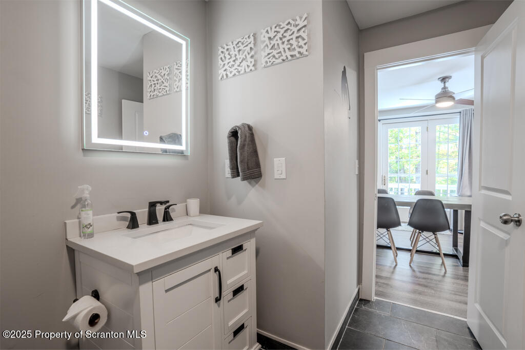 4562 Highway 374 Nicholson, PA 18446 - Photo 28 of 38 a bathroom with a sink and a mirror